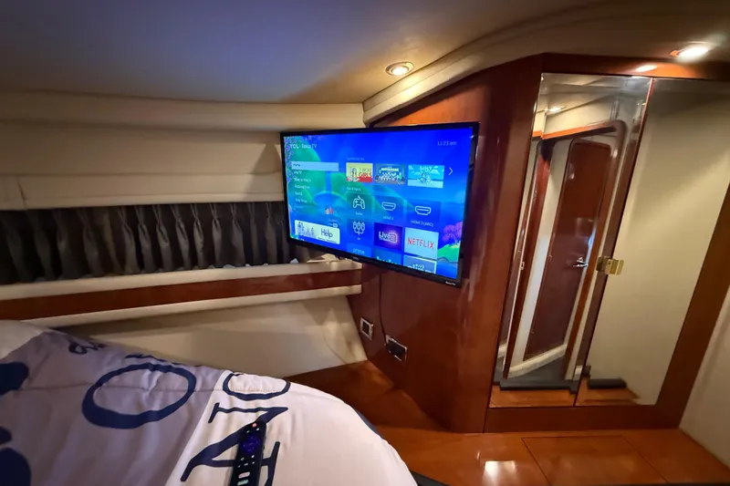 Notorious Yacht Photos Pics Luxurious 2003 Sea Ray 460 Sundancer cabin with TV and modern amenities.