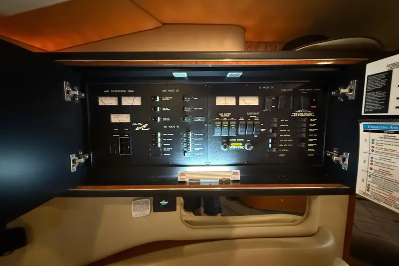 Notorious Yacht Photos Pics Electrical control panel inside 2003 Sea Ray 460 Sundancer yacht, featuring various switches and meters.