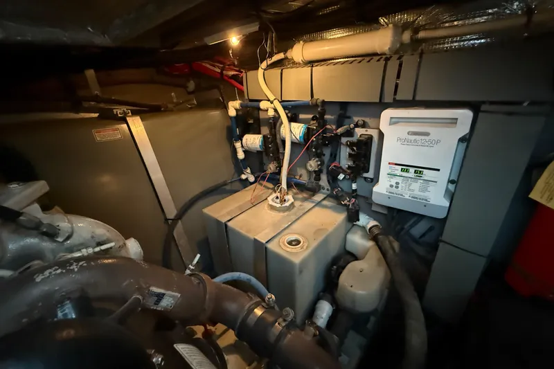 Notorious Yacht Photos Pics Engine room of 2003 Sea Ray 460 Sundancer with ProNautic charger and mechanical components.