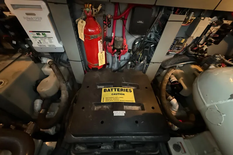 Notorious Yacht Photos Pics Engine room of 2003 Sea Ray 460 Sundancer with battery compartment and fire extinguisher.
