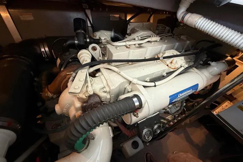 Notorious Yacht Photos Pics Engine room of 2003 Sea Ray 460 Sundancer yacht, showcasing detailed mechanical components.