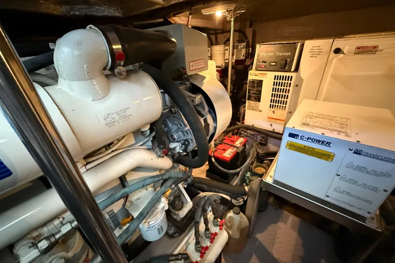 Notorious Yacht Photos Pics Engine room of 2003 Sea Ray 460 Sundancer with marine generator and power systems.