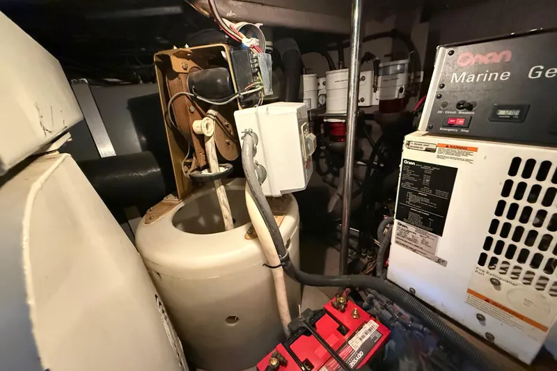 Notorious Yacht Photos Pics Engine room of 2003 Sea Ray 460 Sundancer with Onan marine generator and batteries.