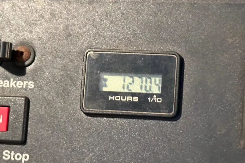 Notorious Yacht Photos Pics Hour meter reading 1210.4 on 2003 Sea Ray 460 Sundancer control panel.