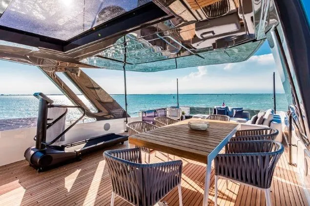  Yacht Photos Pics Luxurious 2017 Ferretti Yachts 850 deck with dining area and ocean view.