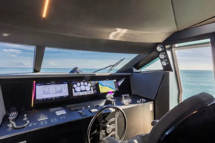  Yacht Photos Pics Cockpit of 2017 Ferretti Yachts 850 with navigation screens and ocean view.