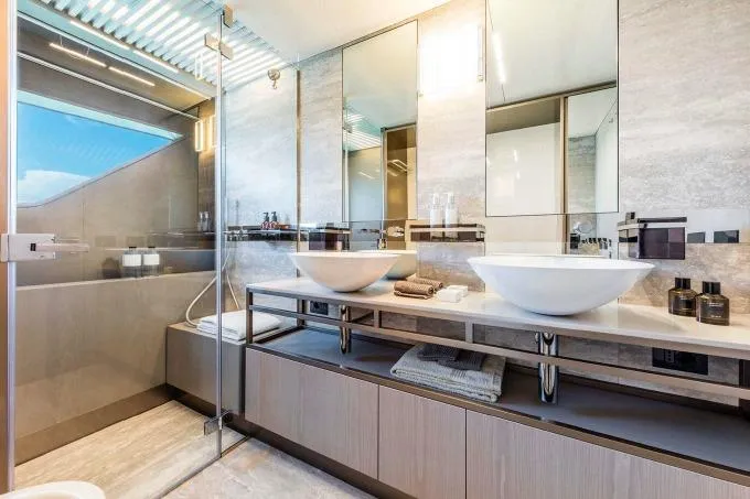  Yacht Photos Pics Luxurious bathroom in 2017 Ferretti Yachts 850 with modern fixtures and elegant design.