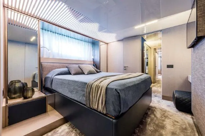 Yacht Photos Pics Luxurious bedroom interior of 2017 Ferretti Yachts 850 with modern design and elegant decor.