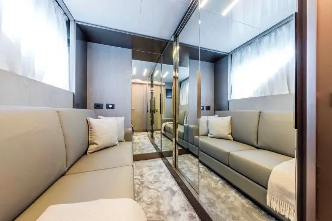  Yacht Photos Pics Luxurious interior of 2017 Ferretti Yachts 850 with elegant seating and mirrored walls.