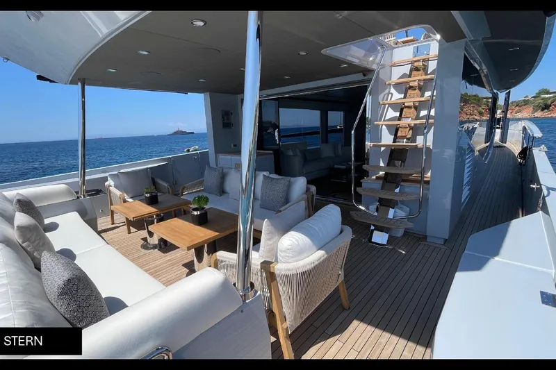  Yacht Photos Pics Luxurious 2023 Numarine 22 XP yacht stern with elegant outdoor seating and ocean view.