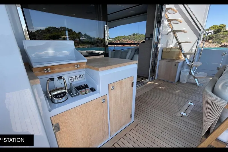  Yacht Photos Pics Luxurious 2023 Numarine 22 XP yacht interior with control station and elegant wooden flooring.