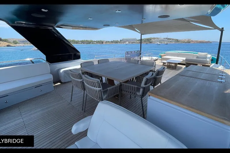  Yacht Photos Pics Luxurious 2023 Numarine 22 XP yacht flybridge with elegant seating and ocean view.