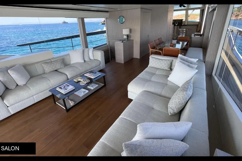  Yacht Photos Pics Luxurious salon interior of 2023 Numarine 22 XP yacht with ocean view.