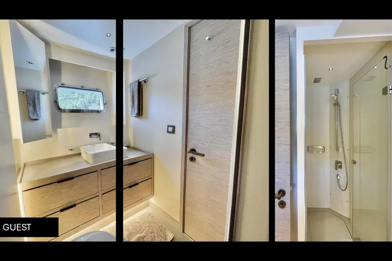  Yacht Photos Pics Luxurious guest bathroom on 2023 Numarine 22 XP yacht, featuring modern fixtures and elegant design.