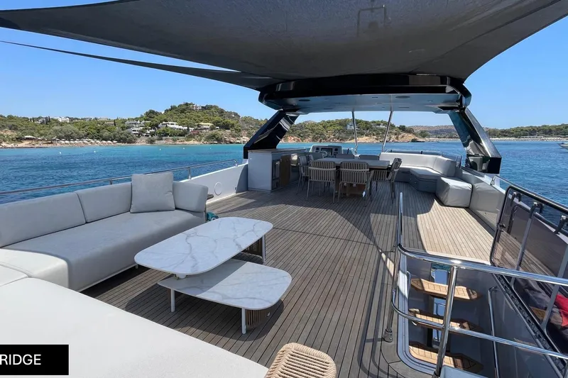  Yacht Photos Pics Luxurious 2023 Numarine 22 XP yacht deck with elegant seating and ocean view.