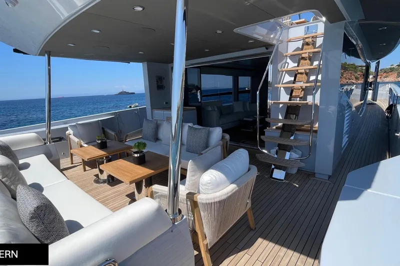  Yacht Photos Pics Luxurious 2023 Numarine 22 XP yacht deck with elegant seating and ocean view.