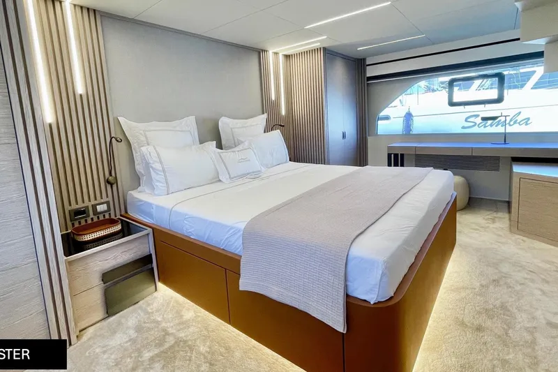  Yacht Photos Pics Luxurious bedroom interior of 2023 Numarine 22 XP yacht with modern design and elegant furnishings.
