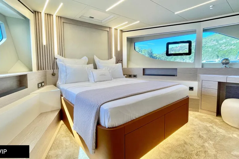  Yacht Photos Pics Luxurious bedroom interior of 2023 Numarine 22 XP yacht with modern design and scenic window view.