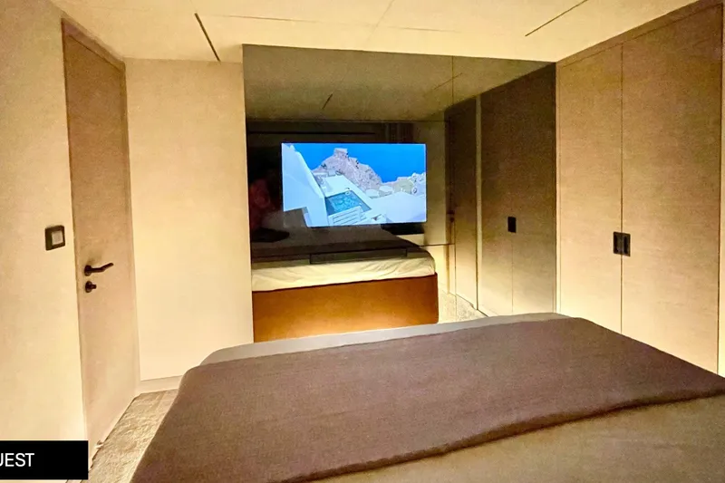  Yacht Photos Pics Luxurious interior of 2023 Numarine 22 XP yacht with modern bedroom and TV.