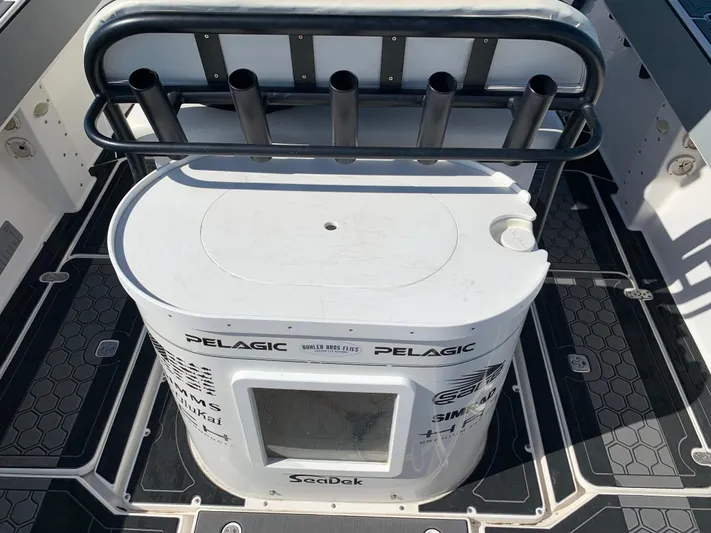 Shaka Yacht Photos Pics 2002 Fountain 38 CC Tournament Edition boat with rod holders and storage compartment.