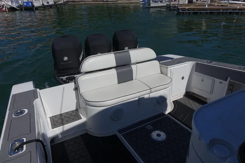 Shaka Yacht Photos Pics 2002 Fountain 38 CC Tournament Edition boat with triple outboard engines and seating area.