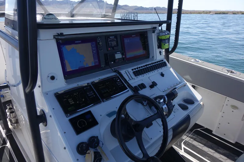 Shaka Yacht Photos Pics Control panel of a 2002 Fountain 38 CC Tournament Edition boat on water.