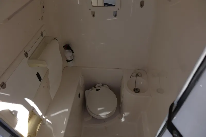 Shaka Yacht Photos Pics 2002 Fountain 38 CC Tournament Edition boat bathroom interior with toilet and sink.