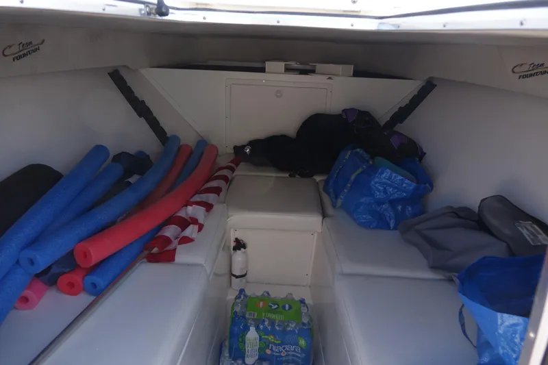 Shaka Yacht Photos Pics Interior of 2002 Fountain 38 CC Tournament Edition boat with storage and supplies.