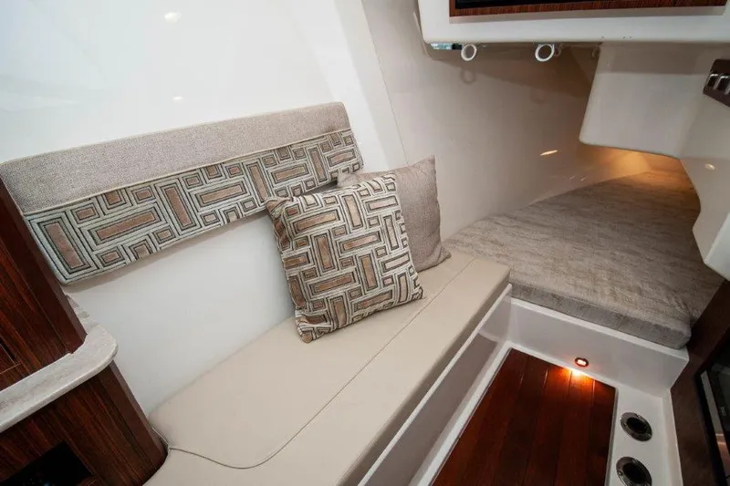 Silver Lining Yacht Photos Pics 2023 Pursuit DC 365 Dual Console interior with cushioned seating and modern design.