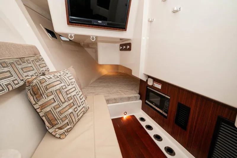 Silver Lining Yacht Photos Pics Luxurious interior of 2023 Pursuit DC 365 Dual Console boat with modern amenities.