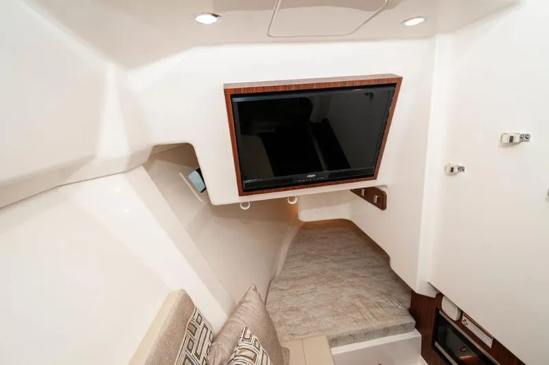 Silver Lining Yacht Photos Pics 2023 Pursuit DC 365 Dual Console cabin with TV and cozy seating area.