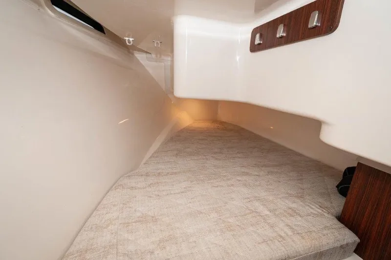 Silver Lining Yacht Photos Pics 2023 Pursuit DC 365 Dual Console cabin interior with cozy sleeping area.