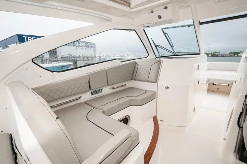 Silver Lining Yacht Photos Pics 2023 Pursuit DC 365 Dual Console interior with elegant seating and modern design.