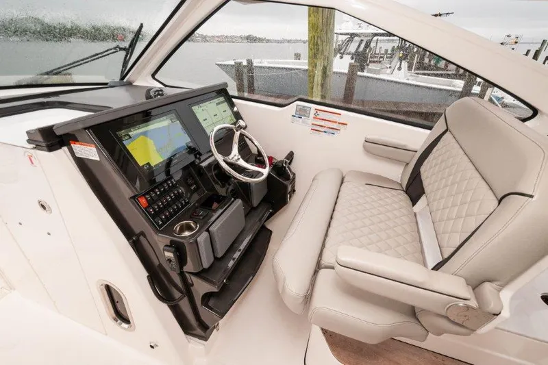 Silver Lining Yacht Photos Pics 2023 Pursuit DC 365 Dual Console helm with modern controls and comfortable seating.
