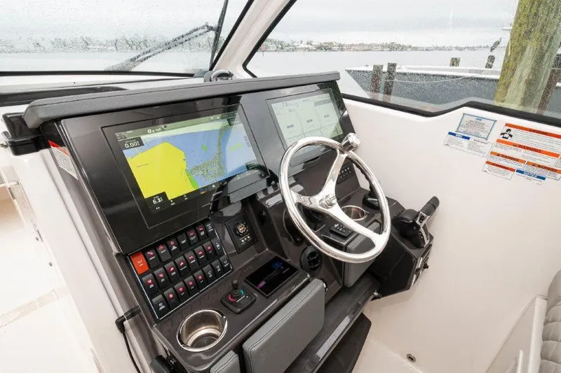 Silver Lining Yacht Photos Pics 2023 Pursuit DC 365 Dual Console helm with advanced navigation displays and controls.