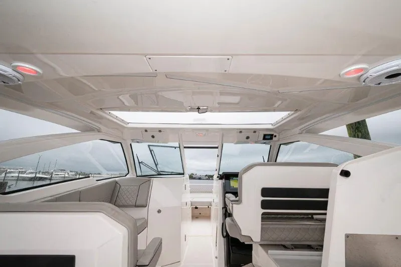Silver Lining Yacht Photos Pics Interior of 2023 Pursuit DC 365 Dual Console boat, featuring modern seating and sleek design.