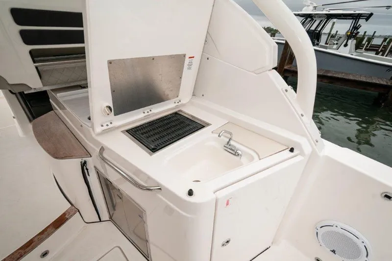 Silver Lining Yacht Photos Pics 2023 Pursuit DC 365 Dual Console boat with outdoor sink and grill setup.