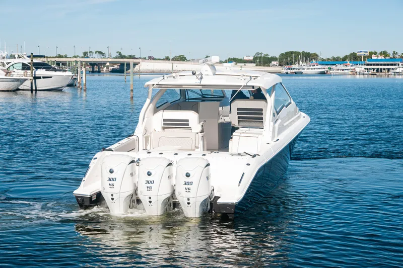 Silver Lining Yacht Photos Pics 2023 Pursuit DC 365 Dual Console boat with triple Yamaha engines on water.