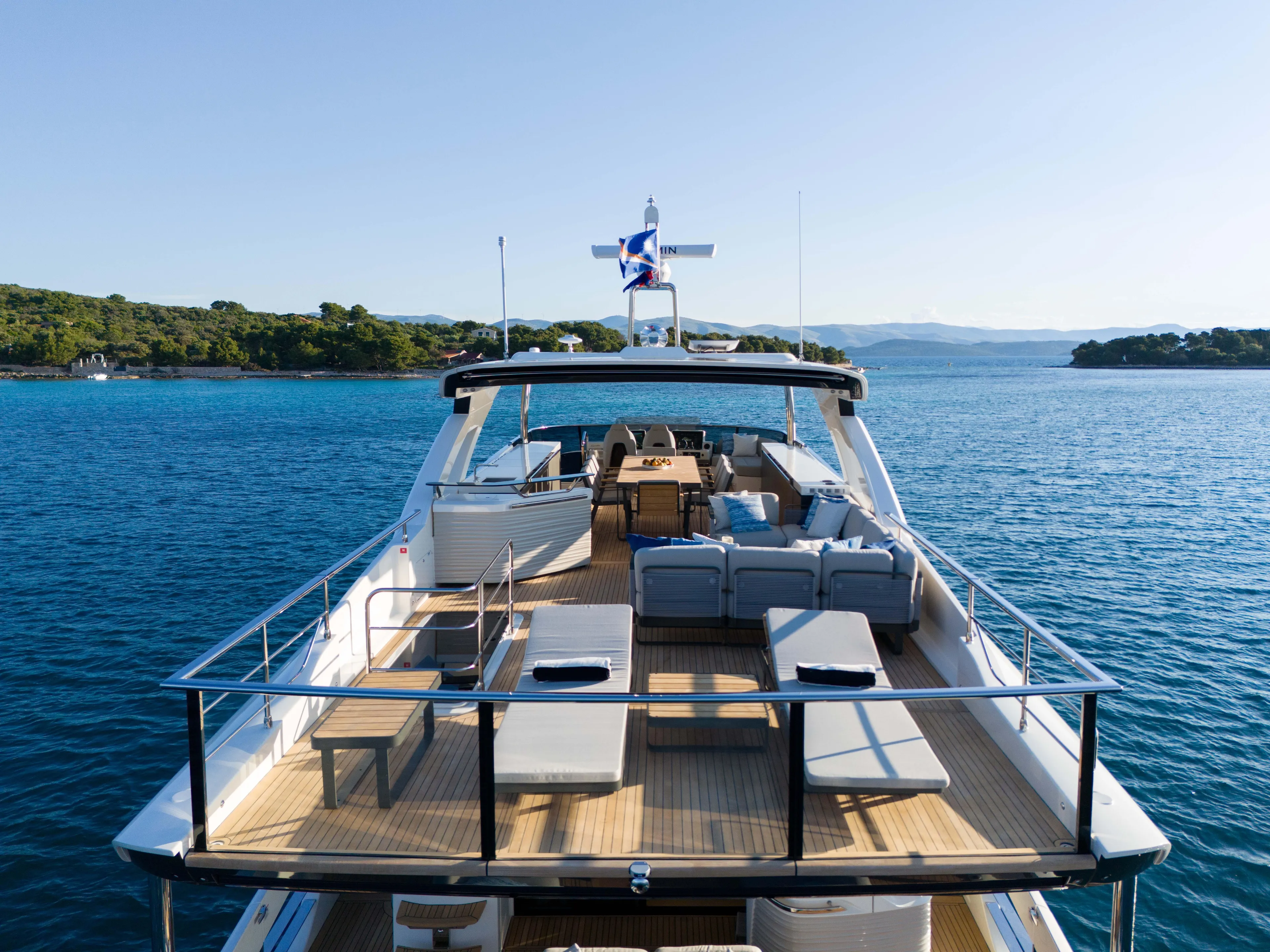 Luxurious 2026 Absolute Navetta Co Ownership yacht on serene blue waters.