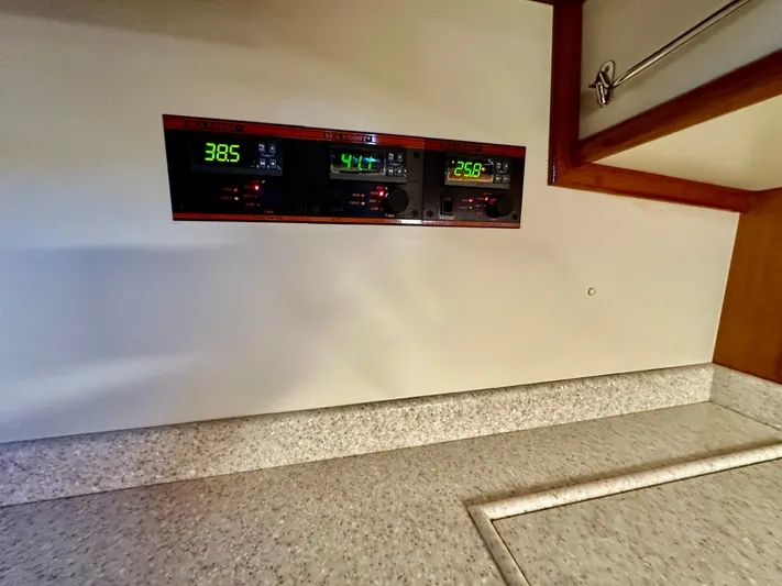 Moonshadow Yacht Photos Pics Control panel on 2004 Grand Banks 49 Eastbay HX yacht, displaying digital readings.