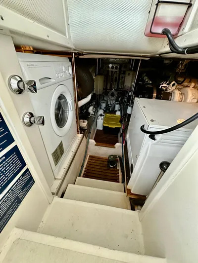 Moonshadow Yacht Photos Pics Engine room of 2004 Grand Banks 49 Eastbay HX with washer and equipment.