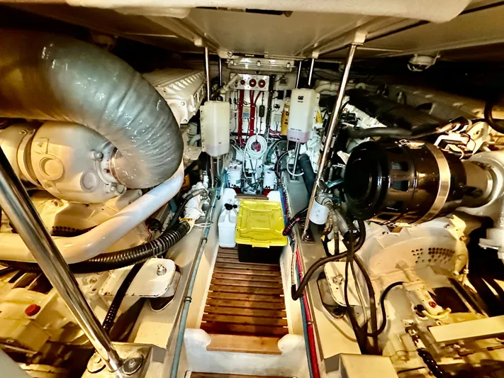 Moonshadow Yacht Photos Pics Engine room of 2004 Grand Banks 49 Eastbay HX, showcasing mechanical components and systems.