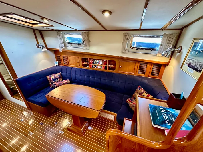 Moonshadow Yacht Photos Pics Luxurious 2004 Grand Banks 49 Eastbay HX yacht interior with elegant seating and wooden finishes.