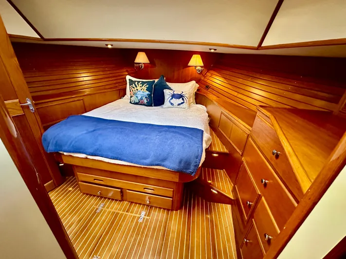 Moonshadow Yacht Photos Pics Luxurious 2004 Grand Banks 49 Eastbay HX cabin with cozy bed and elegant wood finish.