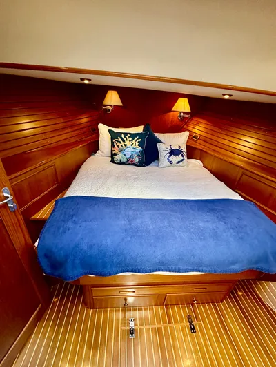 Moonshadow Yacht Photos Pics Luxurious cabin interior of 2004 Grand Banks 49 Eastbay HX with cozy bedding.