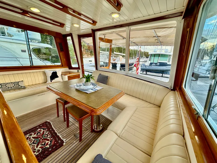 Moonshadow Yacht Photos Pics Luxurious 2004 Grand Banks 49 Eastbay HX yacht interior with elegant seating and dining area.