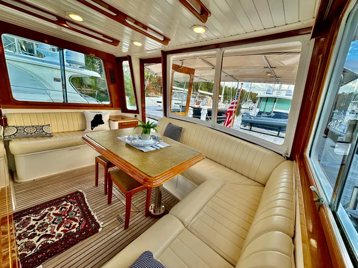 Moonshadow Yacht Photos Pics Luxurious interior of 2004 Grand Banks 49 Eastbay HX yacht with elegant seating and dining area.