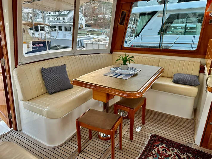 Moonshadow Yacht Photos Pics Luxurious 2004 Grand Banks 49 Eastbay HX yacht interior with elegant seating and dining area.