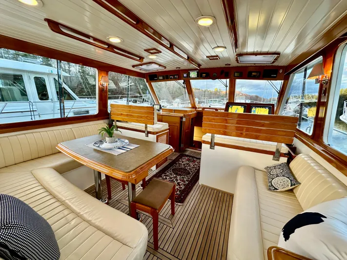 Moonshadow Yacht Photos Pics Luxurious 2004 Grand Banks 49 Eastbay HX yacht interior with elegant wood and leather seating.