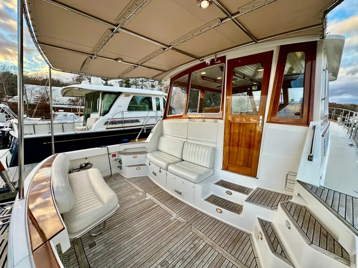 Moonshadow Yacht Photos Pics 2004 Grand Banks 49 Eastbay HX yacht with spacious teak deck and comfortable seating.